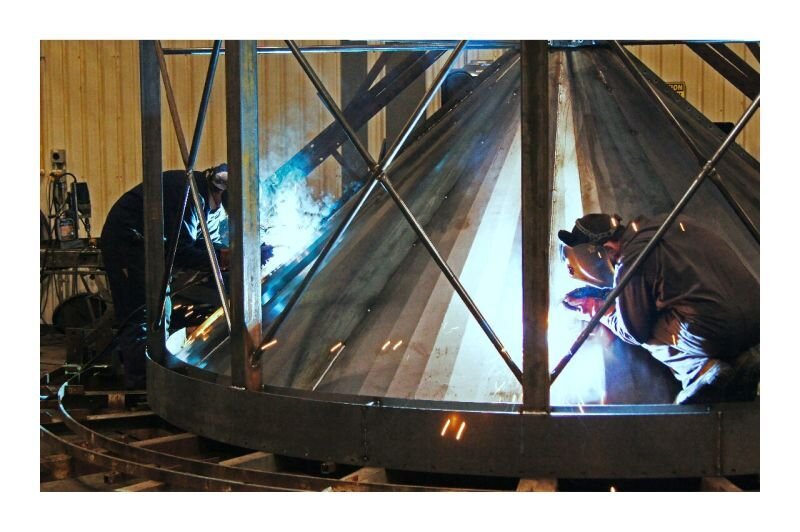 Welding steel cone section for grain storage bin